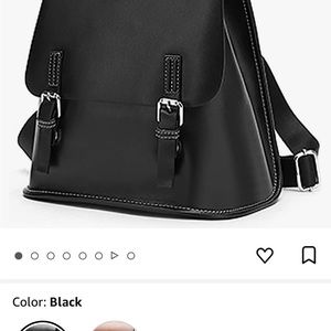 Black cowhide leather backpack with GOLD TONE hardware, new with tags.